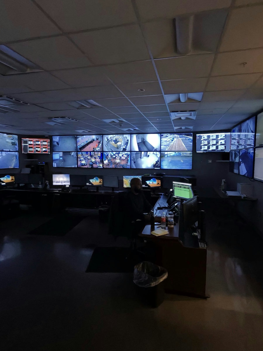 A real casino surveillance operations center, the wall of camera feeds eConnect turns into names, networks, and alerts